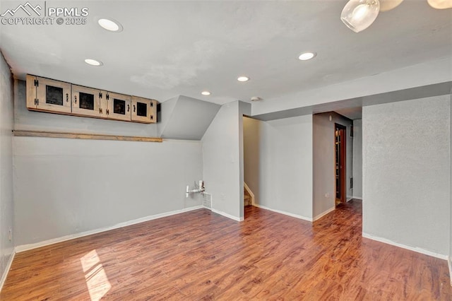 6465 Pawnee Cir, Colorado Springs, CO 80915 - bonus room with stairway, baseboards, recessed lighting, and wood finished floors