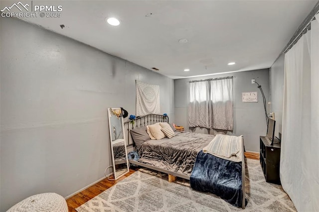 6465 Pawnee Cir, Colorado Springs, CO 80915 - bedroom featuring recessed lighting, wood finished floors, and visible vents