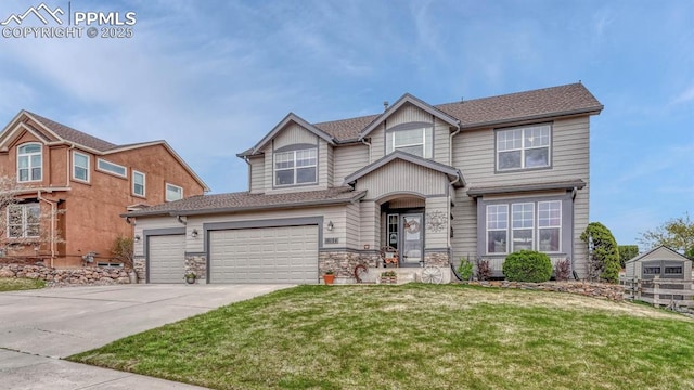 16184 Gold Creek Dr, Monument, CO 80132 - view of front facade featuring a front yard, concrete driveway, stone siding, and roof with shingles