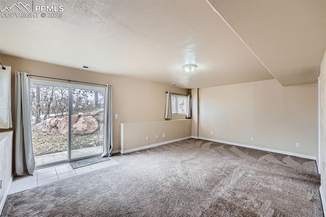 7465 Winding Oaks Dr, Colorado Springs, CO 80919 - carpeted spare room with baseboards and a textured ceiling