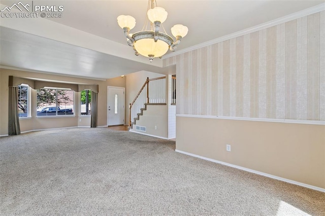 6675 Cabin Creek Dr, Colorado Springs, CO 80923 - unfurnished room with stairway, carpet, a chandelier, baseboards, and ornamental molding