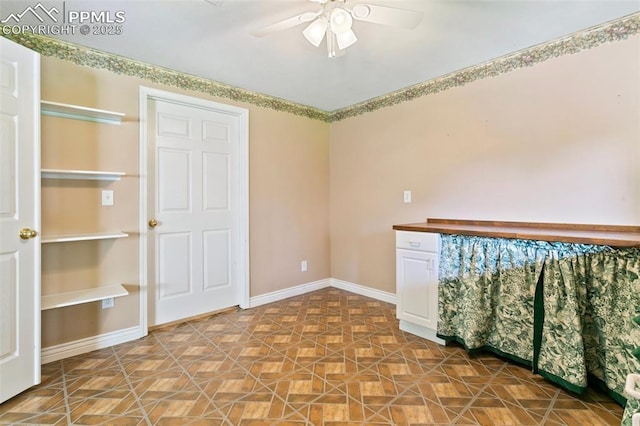 6675 Cabin Creek Dr, Colorado Springs, CO 80923 - spare room with ceiling fan and baseboards