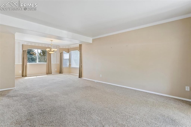 6675 Cabin Creek Dr, Colorado Springs, CO 80923 - spare room with a chandelier, baseboards, ornamental molding, and carpet flooring