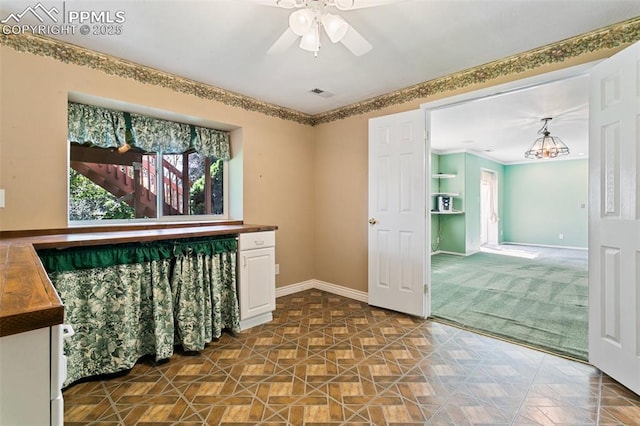6675 Cabin Creek Dr, Colorado Springs, CO 80923 - empty room with a ceiling fan, baseboards, and dark carpet