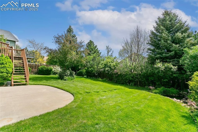 6675 Cabin Creek Dr, Colorado Springs, CO 80923 - view of yard featuring stairs, a wooden deck, and a patio