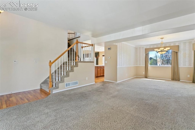 6675 Cabin Creek Dr, Colorado Springs, CO 80923 - unfurnished living room with a chandelier, carpet floors, stairs, and baseboards