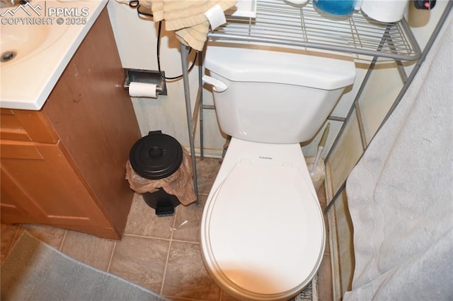 half bathroom with toilet and vanity