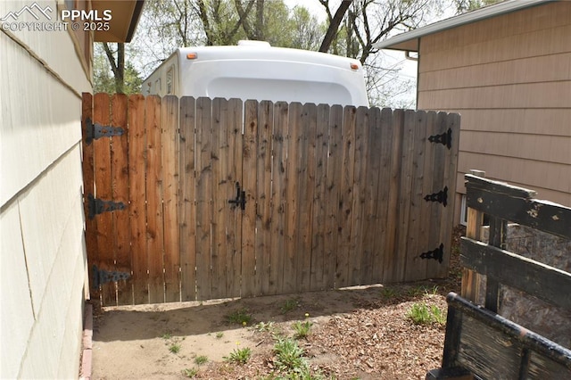 view of gate with fence