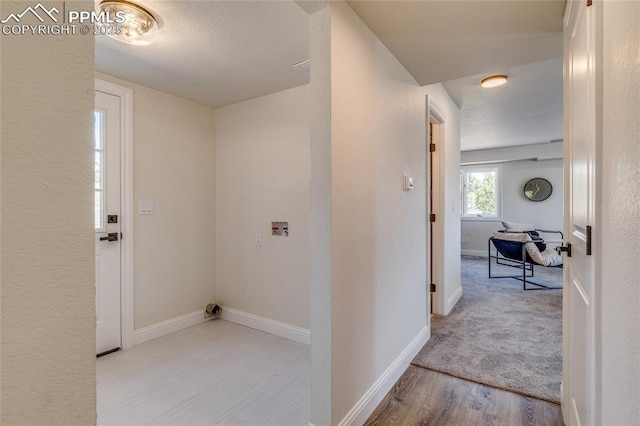 1120 Lake Woodmoor Dr, Monument, CO 80132 - corridor featuring baseboards and wood finished floors