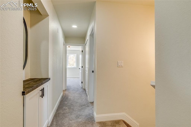 1120 Lake Woodmoor Dr, Monument, CO 80132 - corridor with baseboards, recessed lighting, and light colored carpet