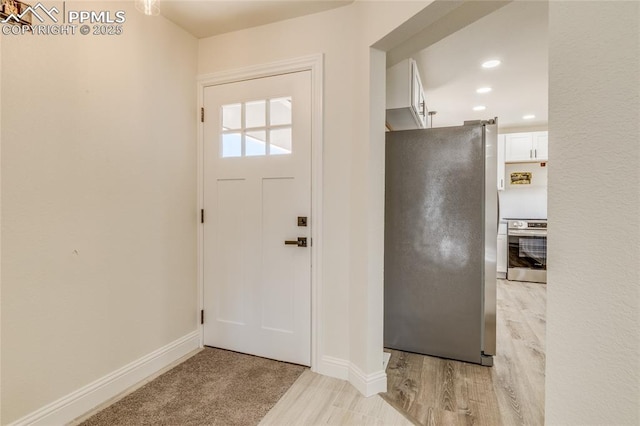 1120 Lake Woodmoor Dr, Monument, CO 80132 - entryway with light wood-style flooring, recessed lighting, and baseboards