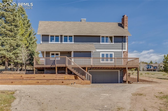 1120 Lake Woodmoor Dr, Monument, CO 80132 - view of front of home with dirt driveway, a chimney, a garage, and roof with shingles