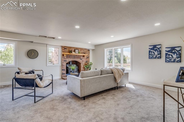 1120 Lake Woodmoor Dr, Monument, CO 80132 - carpeted living room featuring baseboards, a fireplace, recessed lighting, a textured ceiling, and visible vents
