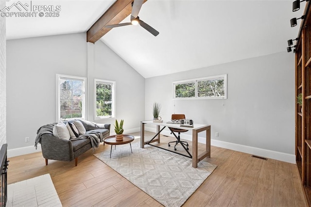 office space featuring visible vents, beam ceiling, light wood-style floors, and ceiling fan