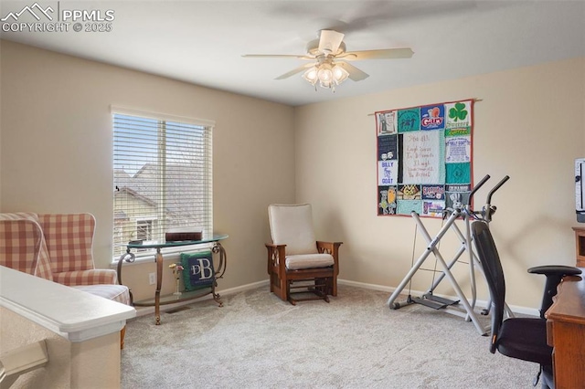 interior space featuring carpet floors, ceiling fan, and baseboards
