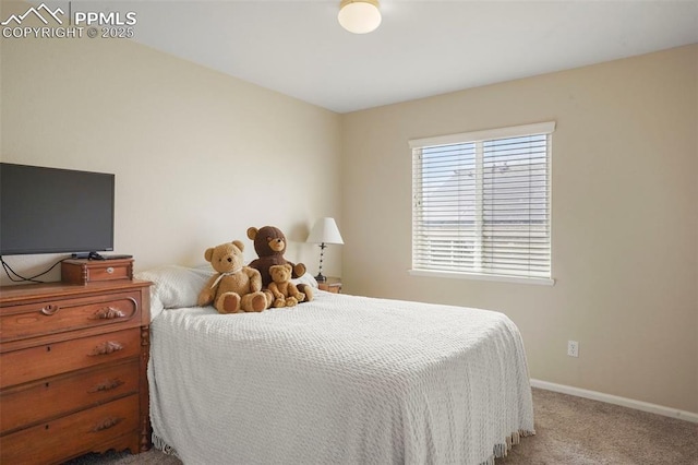 carpeted bedroom with baseboards