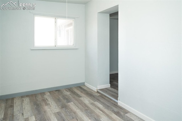 1015 5th St, Del Norte, CO 81132 - empty room featuring baseboards and wood finished floors