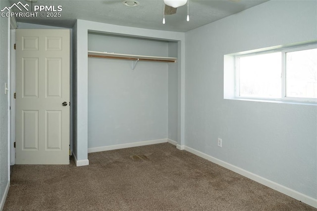 1015 5th St, Del Norte, CO 81132 - unfurnished bedroom with a closet, carpet flooring, and baseboards