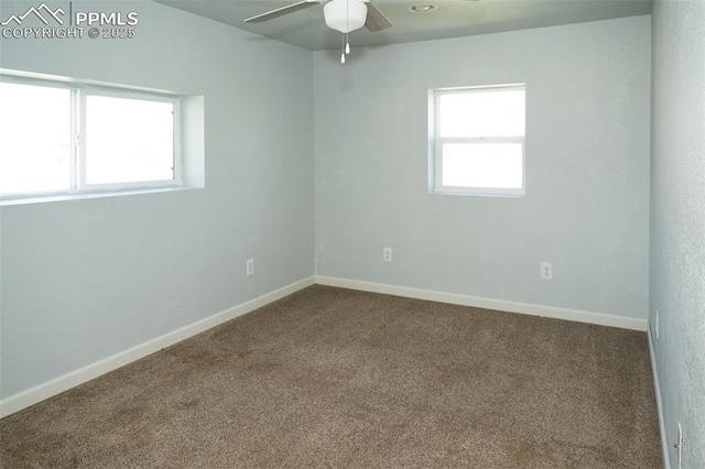 1015 5th St, Del Norte, CO 81132 - empty room with dark colored carpet, baseboards, and a ceiling fan