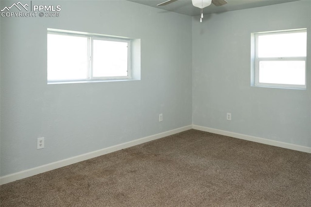1015 5th St, Del Norte, CO 81132 - empty room featuring dark colored carpet, baseboards, and ceiling fan