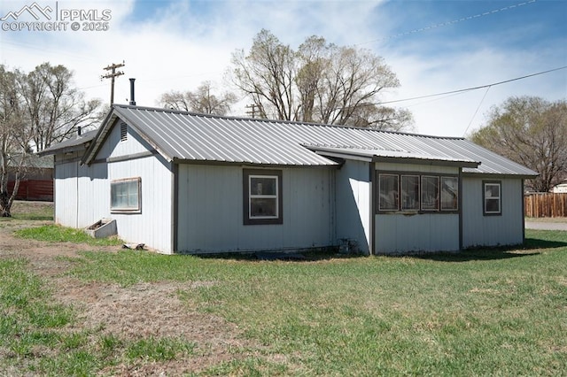 1015 5th St, Del Norte, CO 81132 - exterior space with fence, a yard, and metal roof