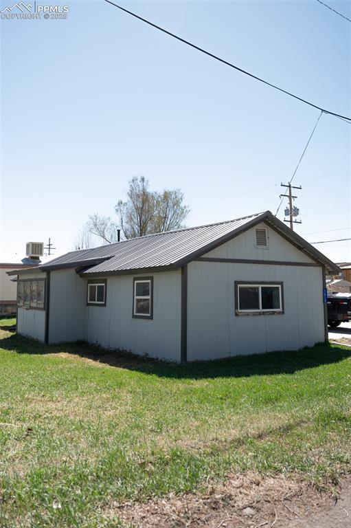 1015 5th St, Del Norte, CO 81132 - view of property exterior with a yard