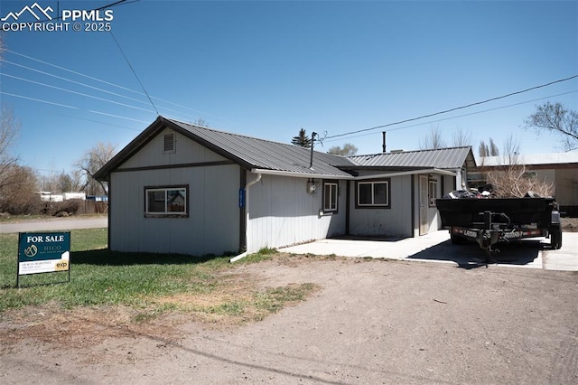 1015 5th St, Del Norte, CO 81132 - view of front of house with metal roof