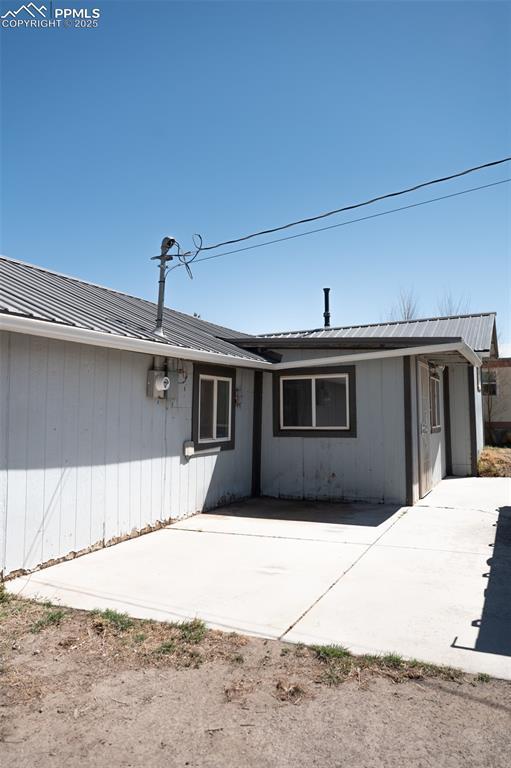 1015 5th St, Del Norte, CO 81132 - exterior space with a patio and metal roof