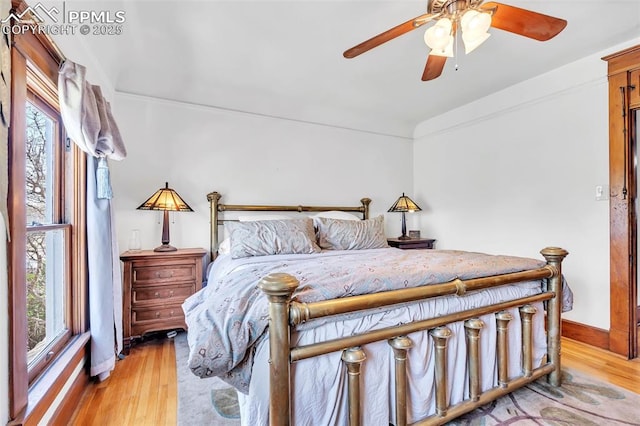 bedroom with baseboards and light wood-type flooring