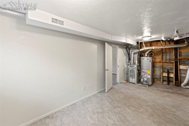 621 Rowe Ln, Colorado Springs, CO 80911 - unfinished below grade area featuring water heater, visible vents, baseboards, and heating unit
