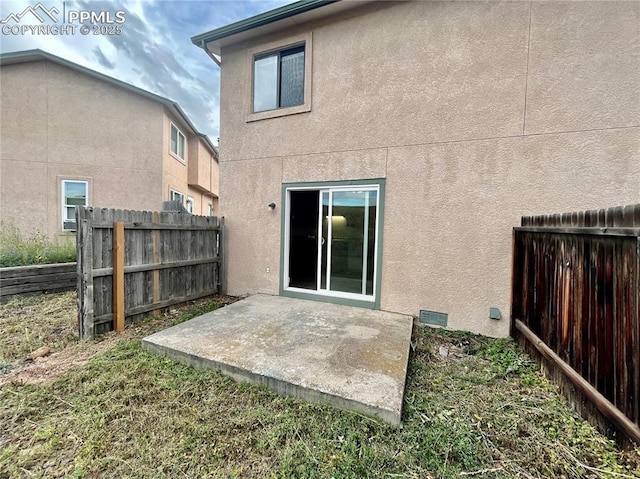 1154 Darby St, Colorado Springs, CO 80907 - back of house featuring stucco siding, a fenced backyard, and a patio