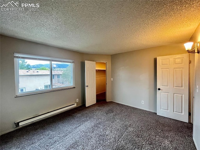 1154 Darby St, Colorado Springs, CO 80907 - unfurnished bedroom with a baseboard radiator, carpet flooring, and a textured ceiling