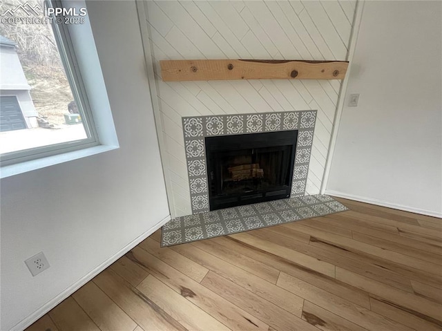 1426 Territory Trl, Colorado Springs, CO 80919 - interior details with a tile fireplace and wood finished floors