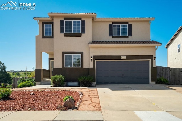 5717 Stable Ct, Colorado Springs, CO 80920 - view of front of home with a garage, a tiled roof, stucco siding, and driveway