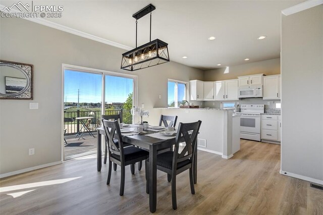 5717 Stable Ct, Colorado Springs, CO 80920 - dining area featuring light wood-type flooring, ornamental molding, baseboards, and recessed lighting