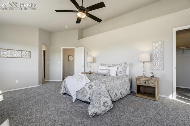 5717 Stable Ct, Colorado Springs, CO 80920 - bedroom with carpet floors, arched walkways, and baseboards