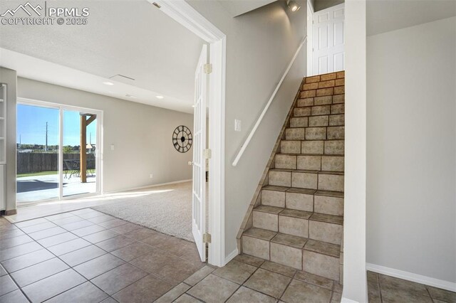 5717 Stable Ct, Colorado Springs, CO 80920 - staircase with baseboards, tile patterned floors, and recessed lighting