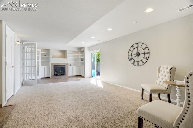 5717 Stable Ct, Colorado Springs, CO 80920 - carpeted living area with baseboards, a glass covered fireplace, and recessed lighting