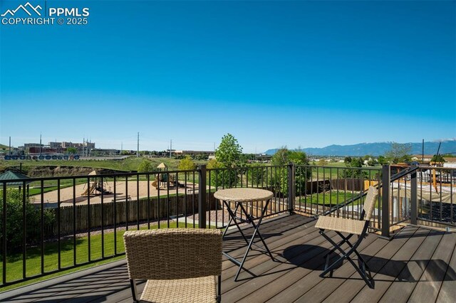 5717 Stable Ct, Colorado Springs, CO 80920 - wooden deck featuring a mountain view