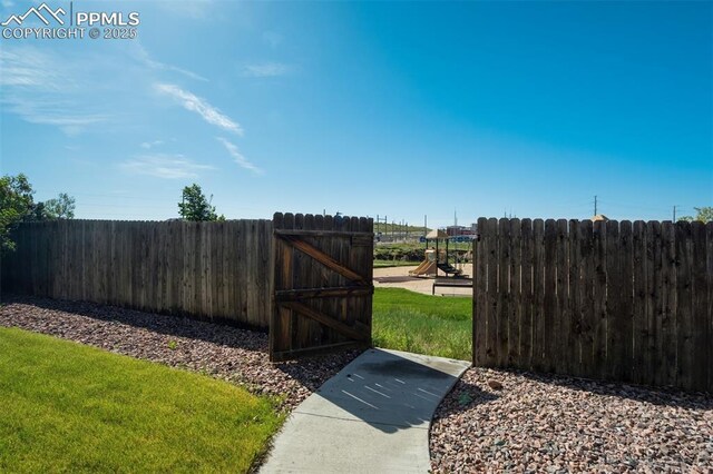 5717 Stable Ct, Colorado Springs, CO 80920 - view of yard featuring a gate