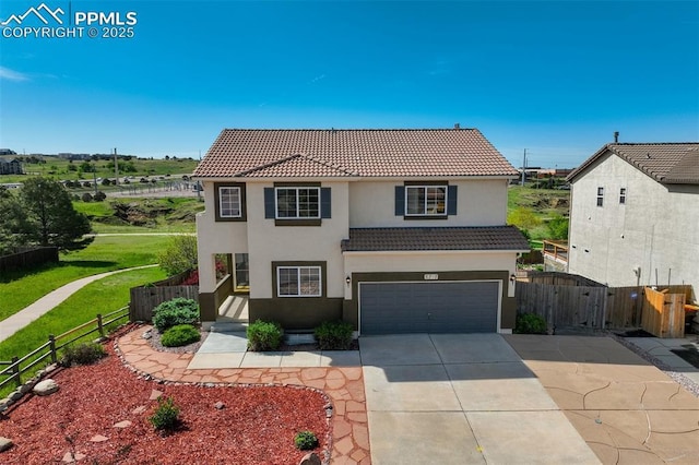 5717 Stable Ct, Colorado Springs, CO 80920 - traditional home featuring concrete driveway, a tile roof, a gate, an attached garage, and stucco siding