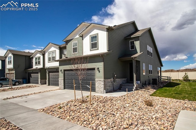 8162 Grey Bark Way, Colorado Springs, CO 80908 - view of front of property featuring a garage, concrete driveway, stone siding, and a residential view