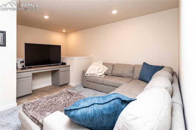8162 Grey Bark Way, Colorado Springs, CO 80908 - living area featuring light carpet, baseboards, and recessed lighting