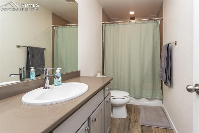 8162 Grey Bark Way, Colorado Springs, CO 80908 - bathroom with vanity, toilet, and wood finished floors