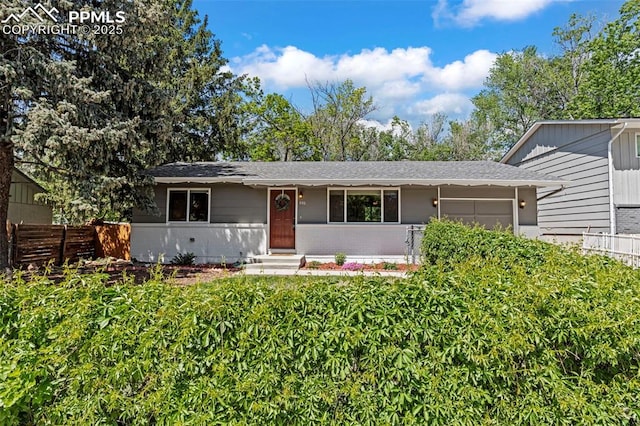 930 Bowser Dr, Colorado Springs, CO 80909 - single story home with a garage, a shingled roof, and brick siding