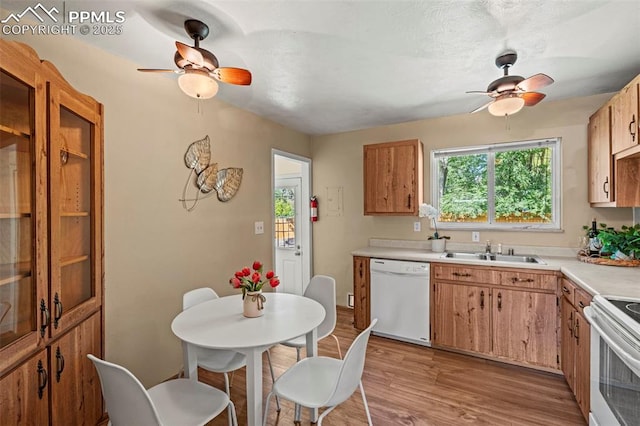 930 Bowser Dr, Colorado Springs, CO 80909 - kitchen with white appliances, ceiling fan, a sink, and light countertops