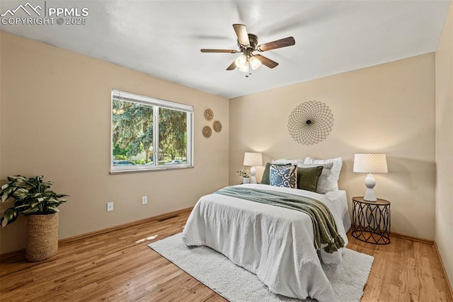 930 Bowser Dr, Colorado Springs, CO 80909 - bedroom featuring wood finished floors, a ceiling fan, and baseboards