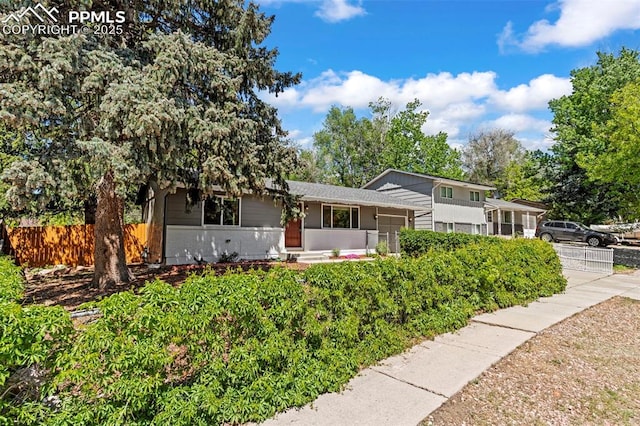 930 Bowser Dr, Colorado Springs, CO 80909 - tri-level home featuring brick siding