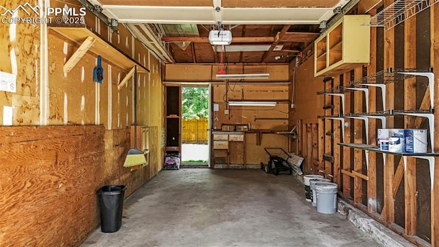 930 Bowser Dr, Colorado Springs, CO 80909 - garage featuring a garage door opener