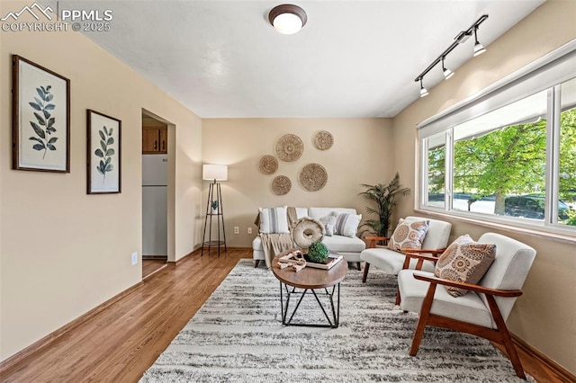 930 Bowser Dr, Colorado Springs, CO 80909 - living area featuring wood finished floors and baseboards